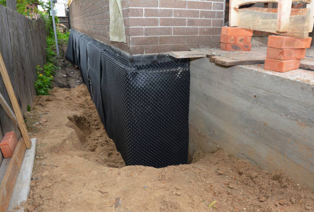 SJ Waterproofing Pros technician performing targeted Waterproofing assessment in Dover, OH